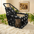 Sac de transport pour chat noir installé sur siège auto avec fixation ceinture de sécurité